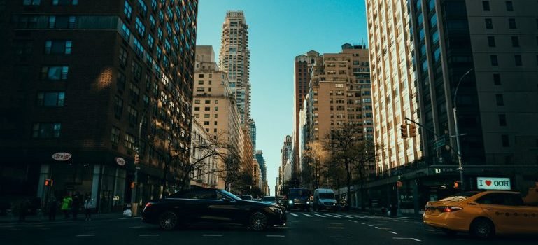 Buildings, cars and people that you can see after moving from Morrisania to Upper East Side.
