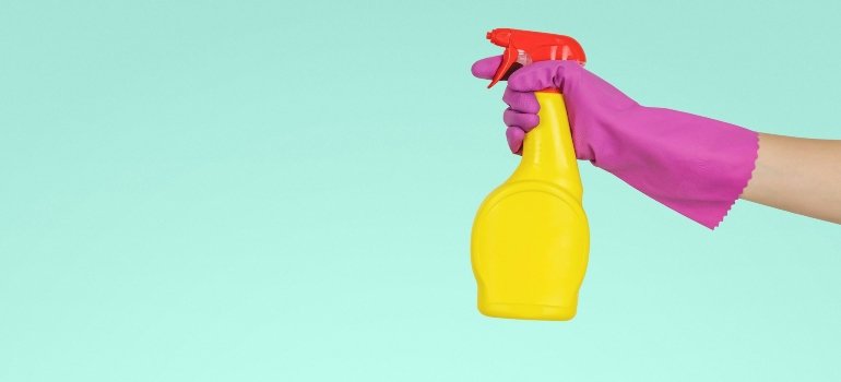 A person cleaning before using self-storage when traveling.