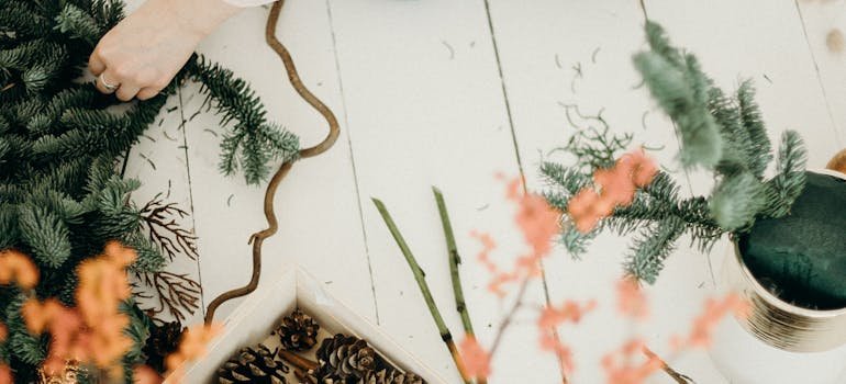 A woman packing away winter decorations, showing how can self storage improve your life by organizing seasonal items