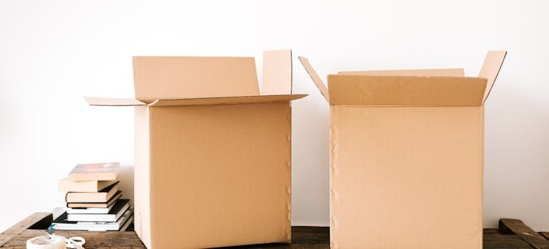 Two cardboard boxes on a desk.