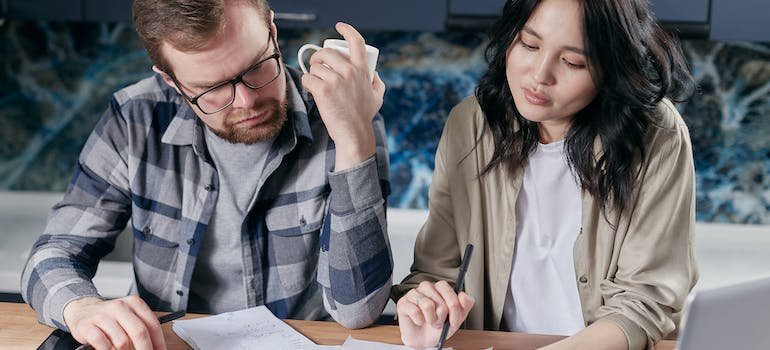 A couple calculating the cost of living since they're moving from Mott Haven to Kingsbridge