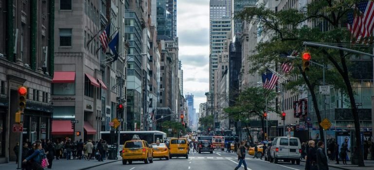 Building, cars and people on the streets of NYC