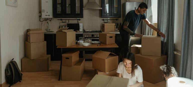 A family packing their belongings before moving to Morningside Heights.