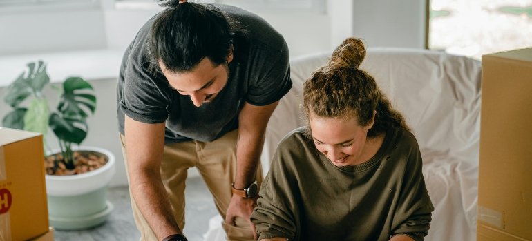 A couple making a plan as you should do before transforming your home for spring with storage.