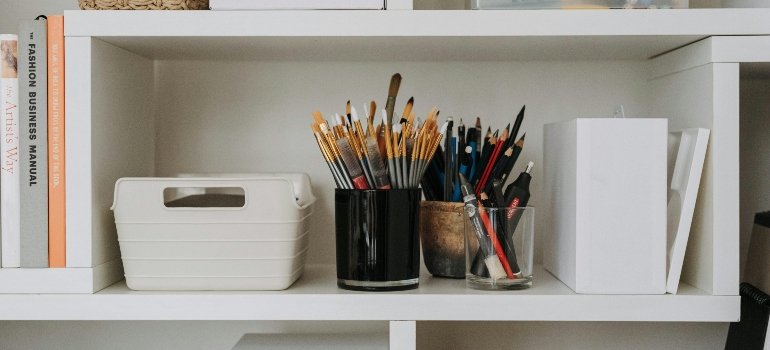A shelf with pencils on it