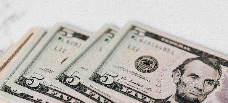 Five-dollar bills.
