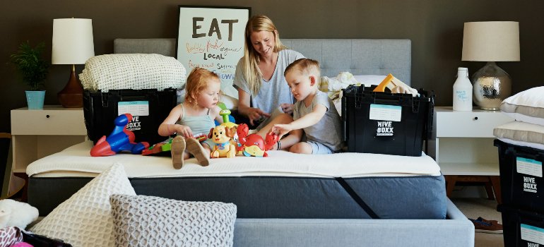 A mother with children is preparing for moving to Tribeca