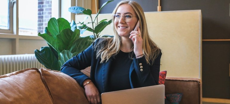 A young woman on a phone call talking about how to relocate in less than a week using portable storage.