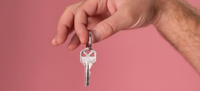 A person holding a key.