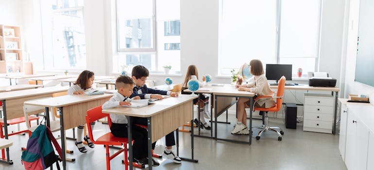 Kids doing schoolwork in a classroom.
