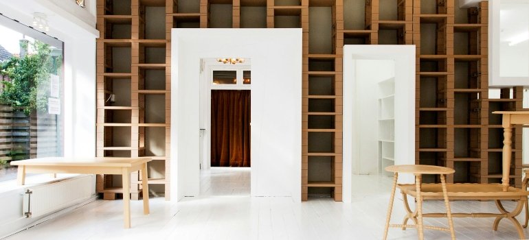 Wooden shelves on the wall as innovative storage ideas for New Yorkers