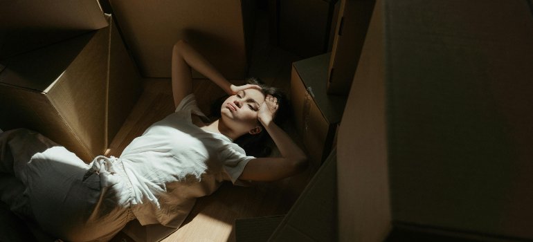A woman feeling stressed out becoause she needs pne of the many affordable storage solutions in the Bronx.