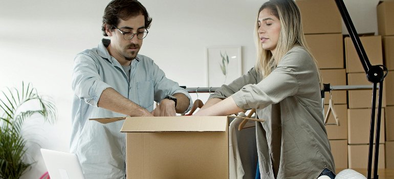 A couple packing items for storage