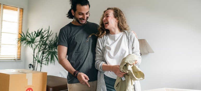 A couple is smiling and considering storage solutions for newlywed couples in Manhattan