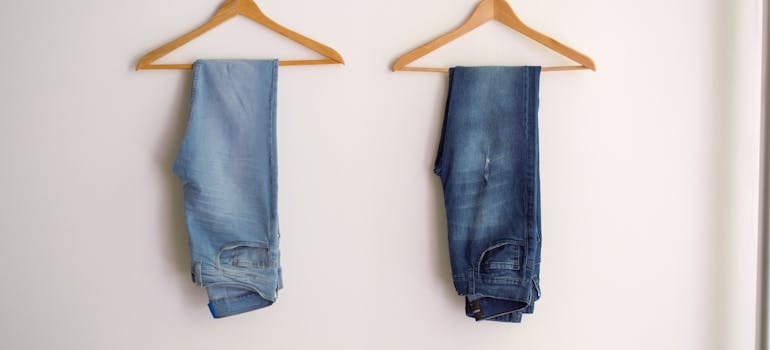 Two pairs of jeans hanging