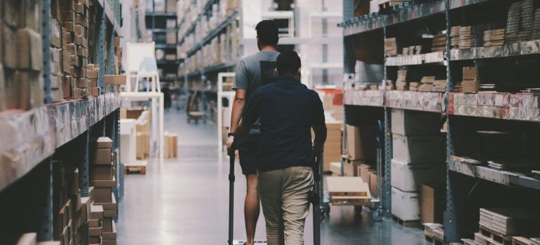 Two men exploring a storage facility as a great example of why Manhattan renters should consider storage