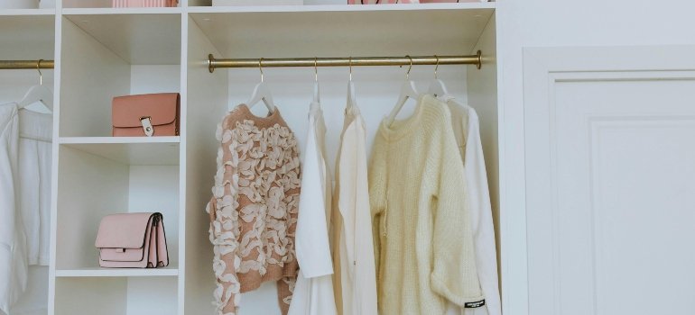 Organized white wooden Closet.