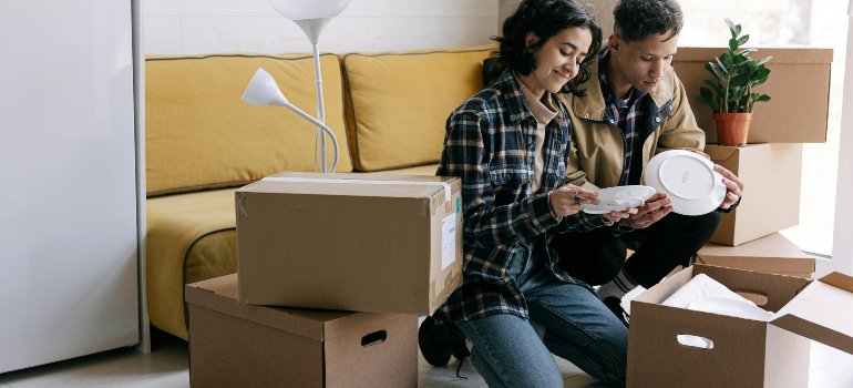 A couple packing for storage