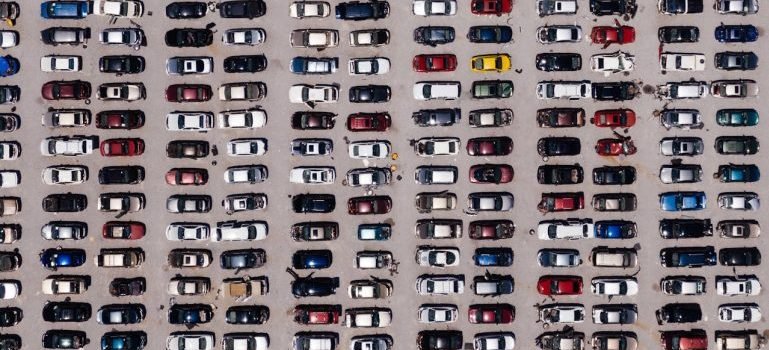 A parking with lot of parked cars as one of the common situations when car storage makes sense