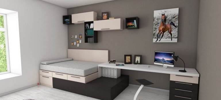 A clean grey and white dorm room