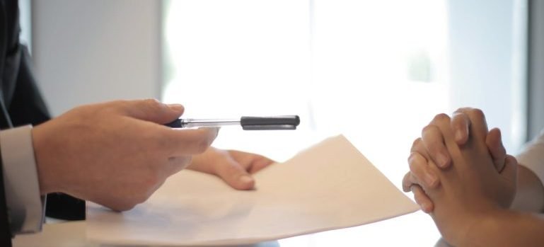 Two people discussing a document.