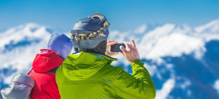 Two men on the mountain in winter gear.