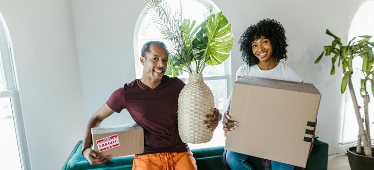 Professional packers carrying various items.