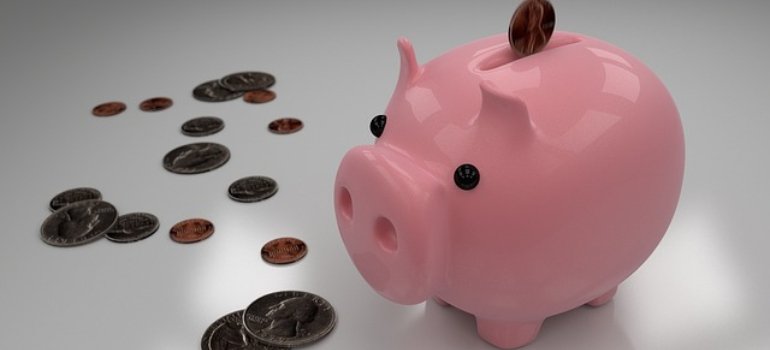 A piggy bank that presents a benefit of renting storage when moving to temporary housing