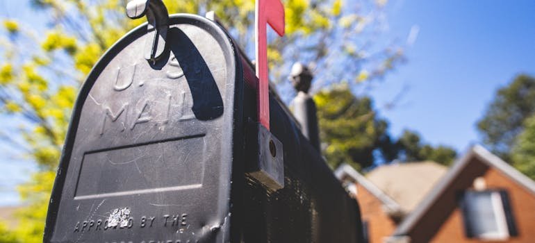 A black mailing box.