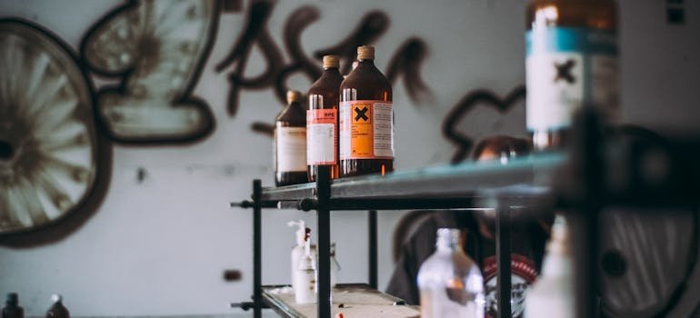 Hazardous bottles on a shelf as things that don't belong in long-term storage