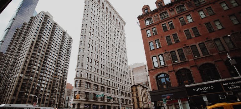 Three sky scrapers on the street.
