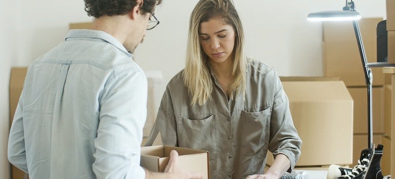 A man and a woman packing.