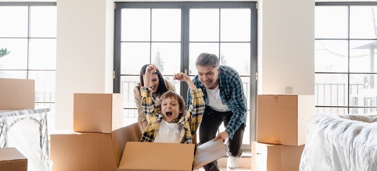 A happy family in their new home after making a plan a family move to the Bronx.