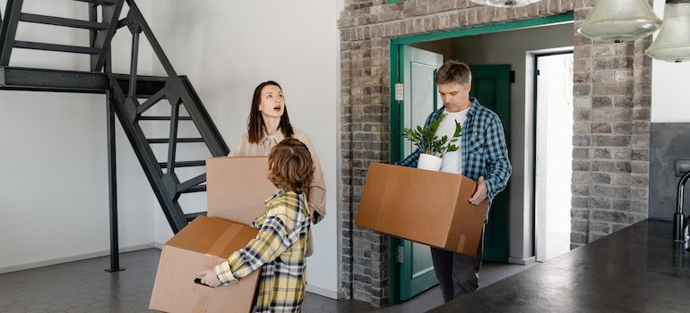 A family moving in after choosing a Manhattan aparatment.
