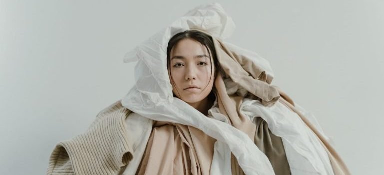 A woman wrapped with fabrics.