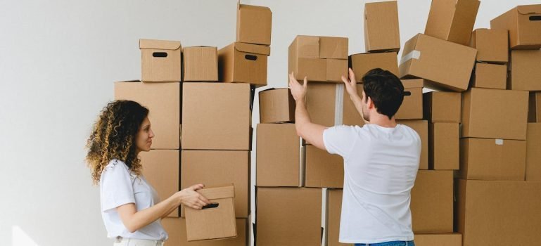 A couple preparing to unpack boxes and start arranging their new Bronx home.