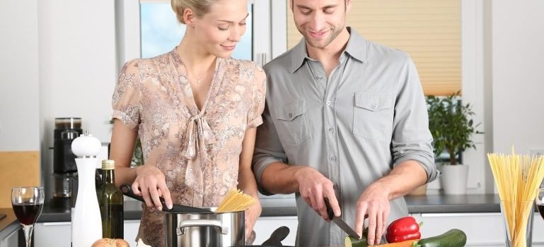 A couple in the kitchen after they finished with arranging their new Bronx home.