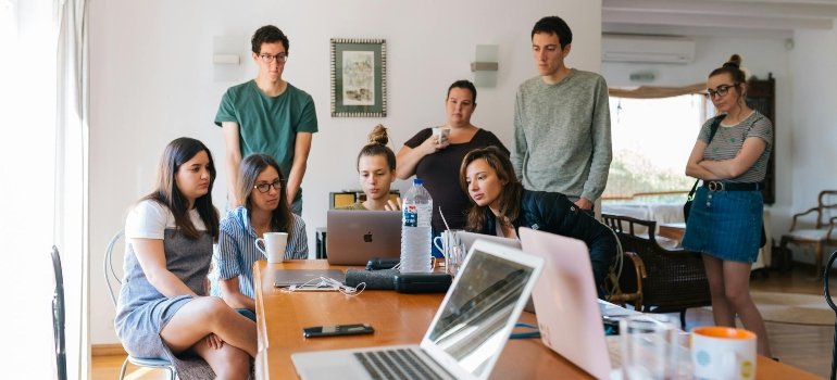 A group of young people researching the Manhattan neighborhoods for young professionals