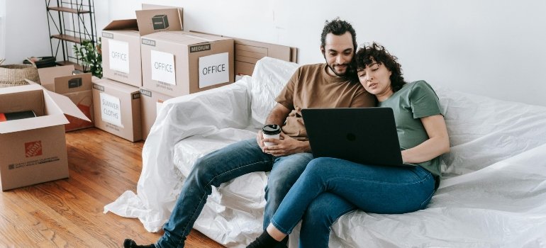 A couple researching Manhattan neighborhoods for young professionals