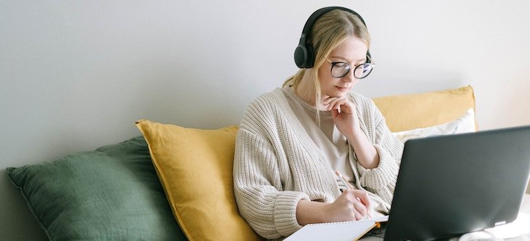 A woman searching online for tips on how to simplify relocation with storage unit in manhattan
