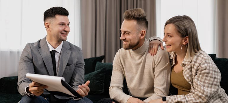a couple wanting to buy a new home in NYC remotely talks to a real estate agent
