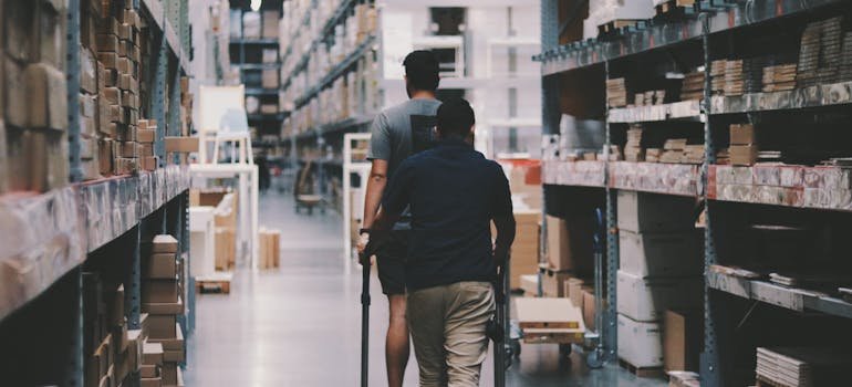 Two men in the storage facility.