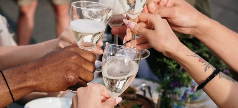 People holding wine glasses