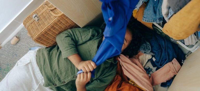 A woman lying on clothes