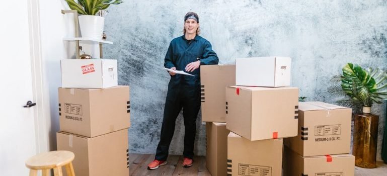A professional organizing boxes at the storage Staten Island NY locals recommend.