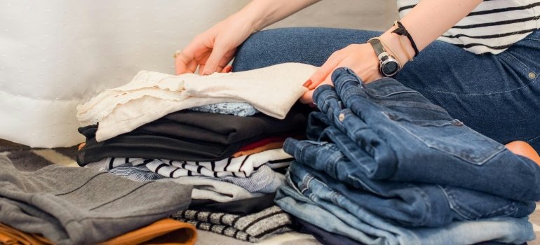 A person organizing clothes.