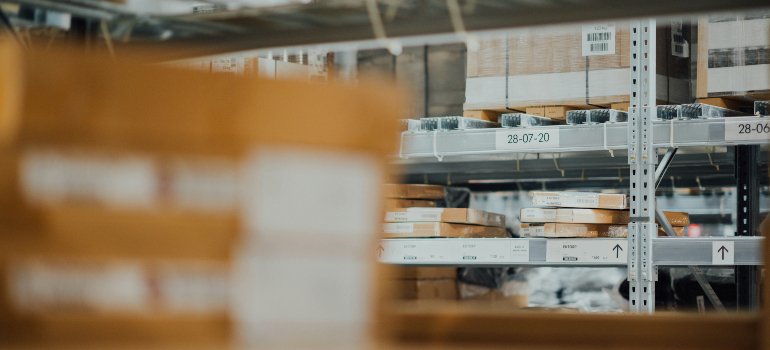 An organized warehouse with shelves stacked with boxes.