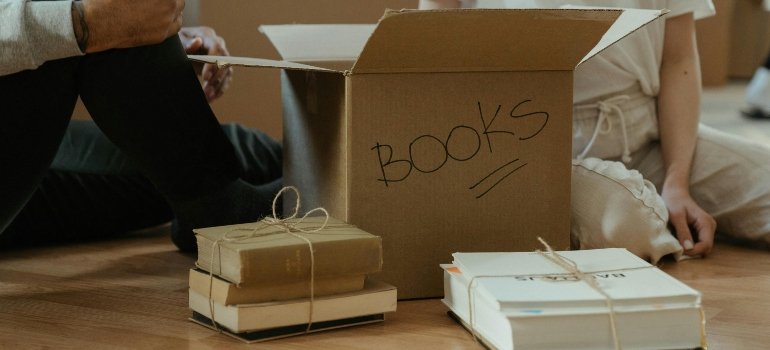 A box with a sign that says "BOOKS".