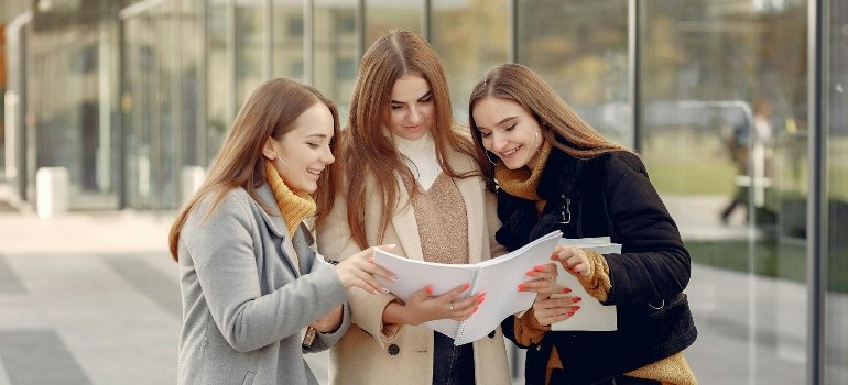 Three students talking about what every student should do before moving to campus.