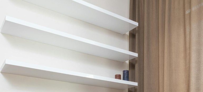 Shelves on a wall touse after you find out all bout the storage costs in Brooklyn this fall.